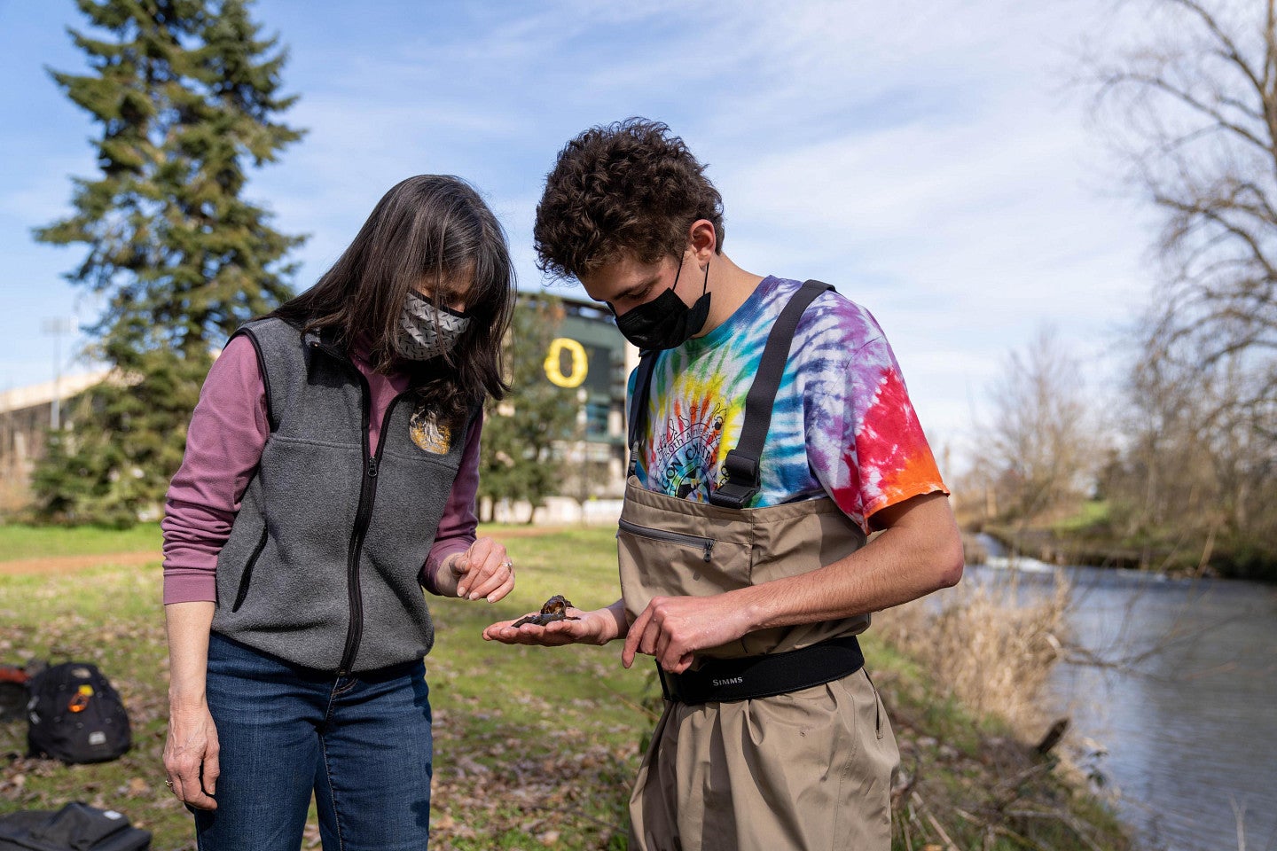 student conducting aquatic research