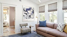 An apartment with many large windows swims in natural light. 