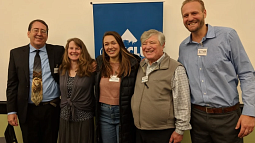 Kelsey Juliana (center) stands with Professor Mary Wood and others involved with the Juliana v. United States fight