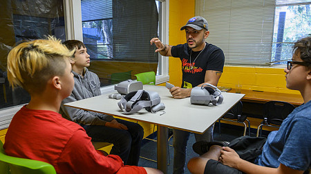Virtual reality researcher Danny Pimentel works with a group of kids.