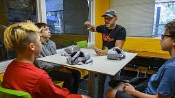 Virtual reality researcher Danny Pimentel works with a group of kids.