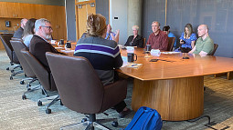 UO wildfire and smoke experts meet with U.S. Sen. Jeff Merkley (red shirt, on right) for a roundtable discussion on the UO’s Wildfire Smoke Center for Research and Practice.