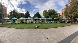 A panoramic view of a line of tables set up for Transportation Day 
