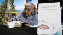 Virginia Roslyn Beavert signs a copy of her book, "Anakú Iwachá: Yakama Legends and Stories" at Yakama Nation Cultural Center in Toppenish, Washington