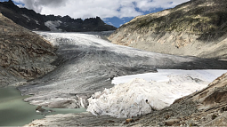 White blankets cover the middle right section of the Rhône Glacier in an attempt to slow ice melt. Photo: Mark Carey