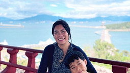 Yekang Ko smiles for a picture with her son as they visit Yeosu, South Korea. 