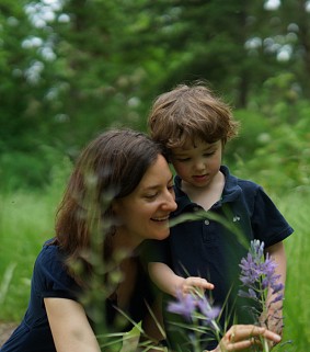Sarah Stapleton looking at flowers with her son